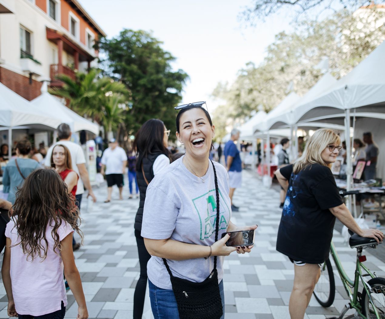 a smiling woman in a crowd