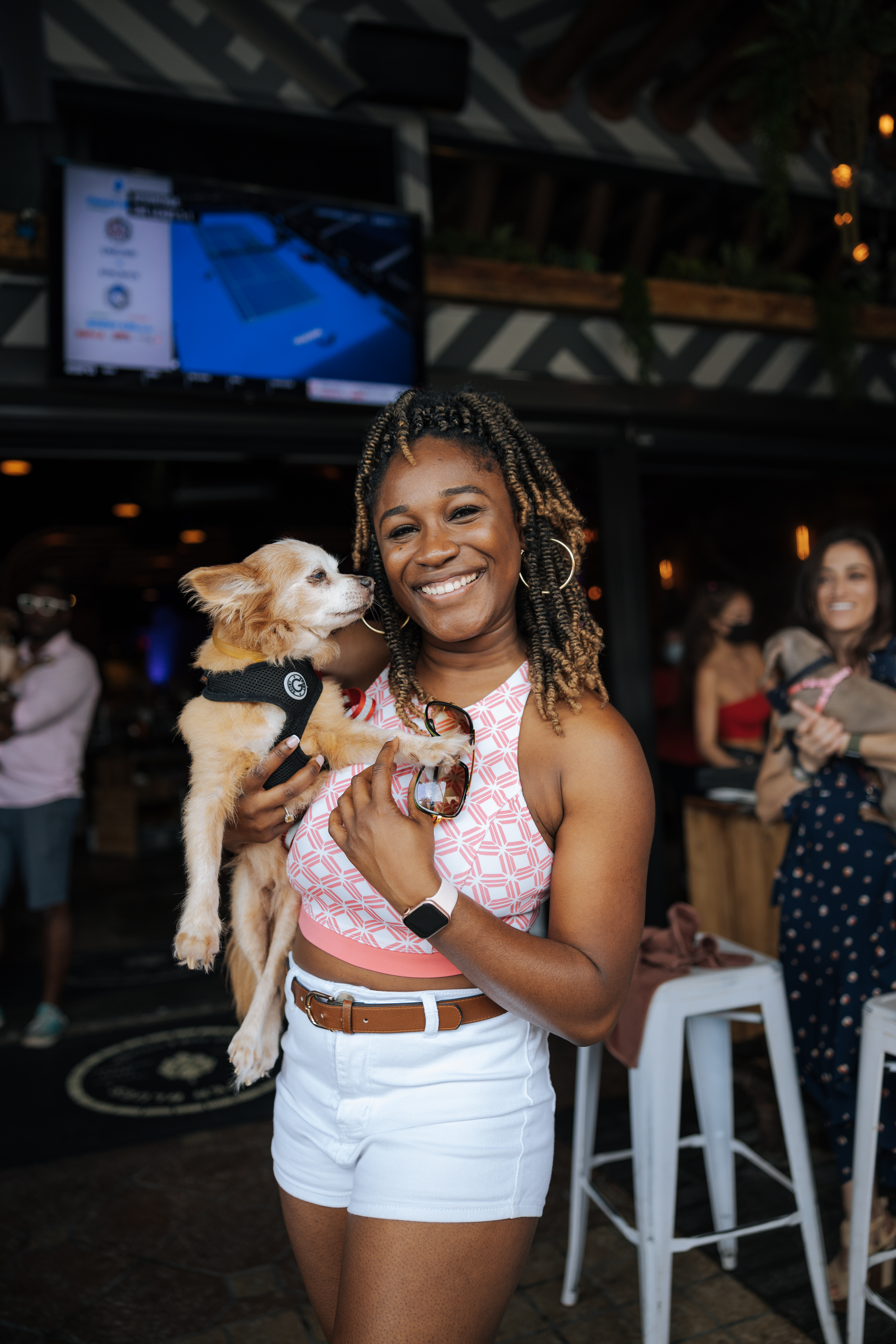 Woman holding small dog