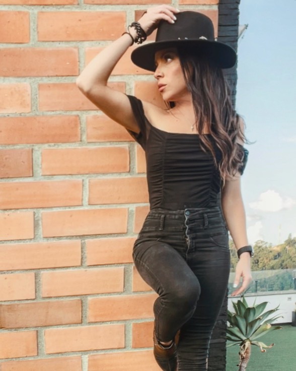 Women standing against brick wall