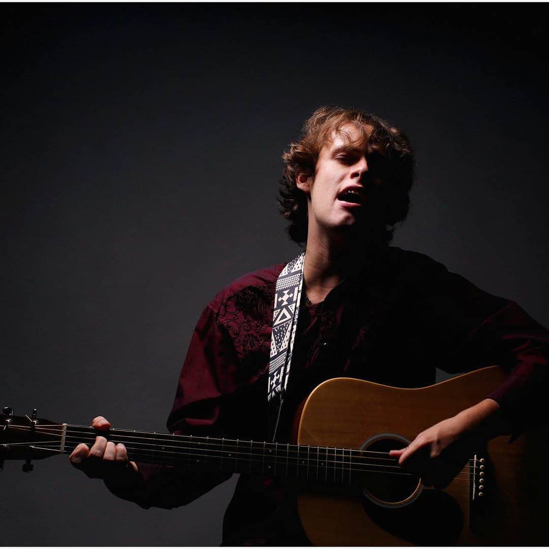 Man singing with guitar