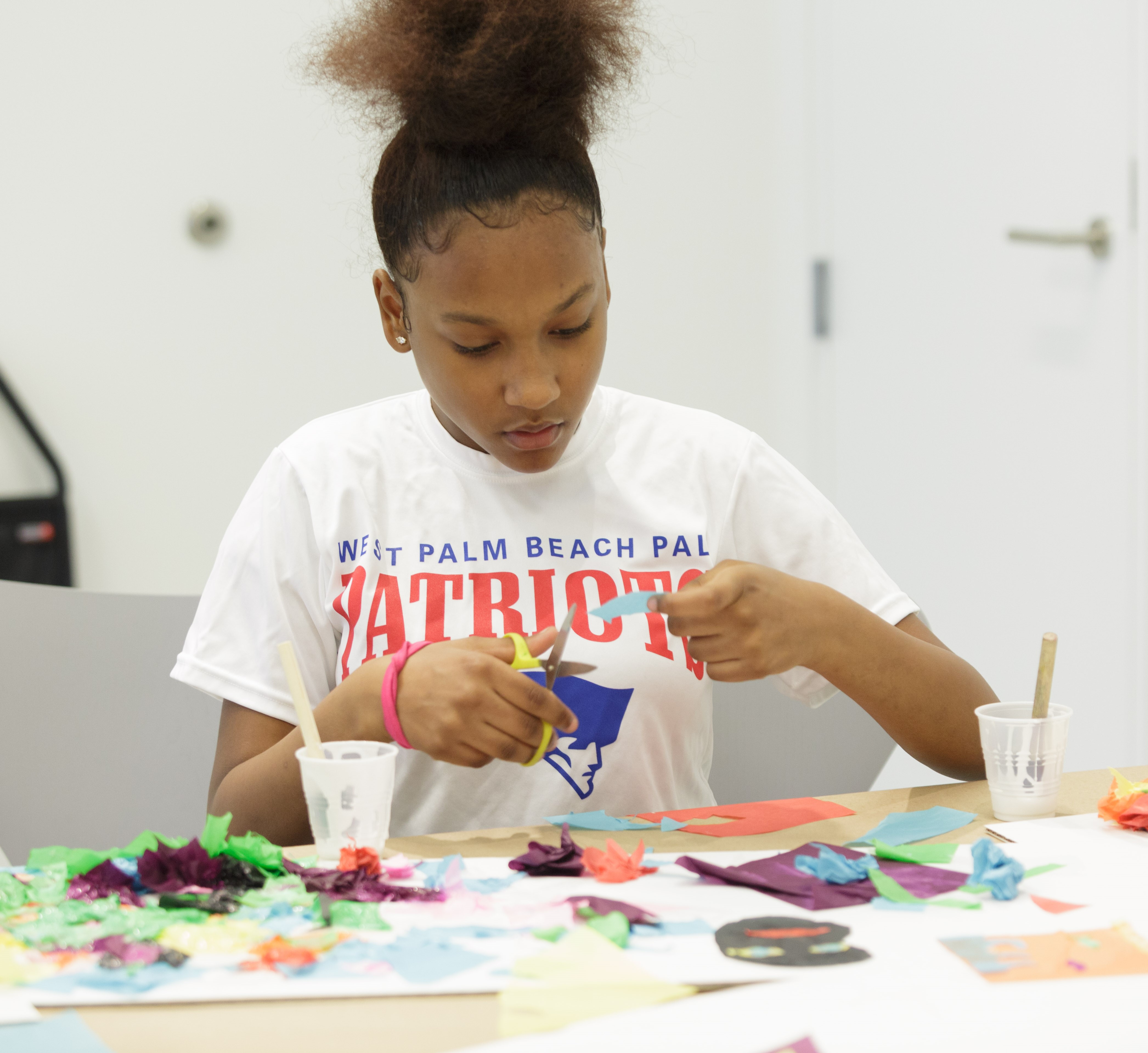 Teenage girl working on an art project