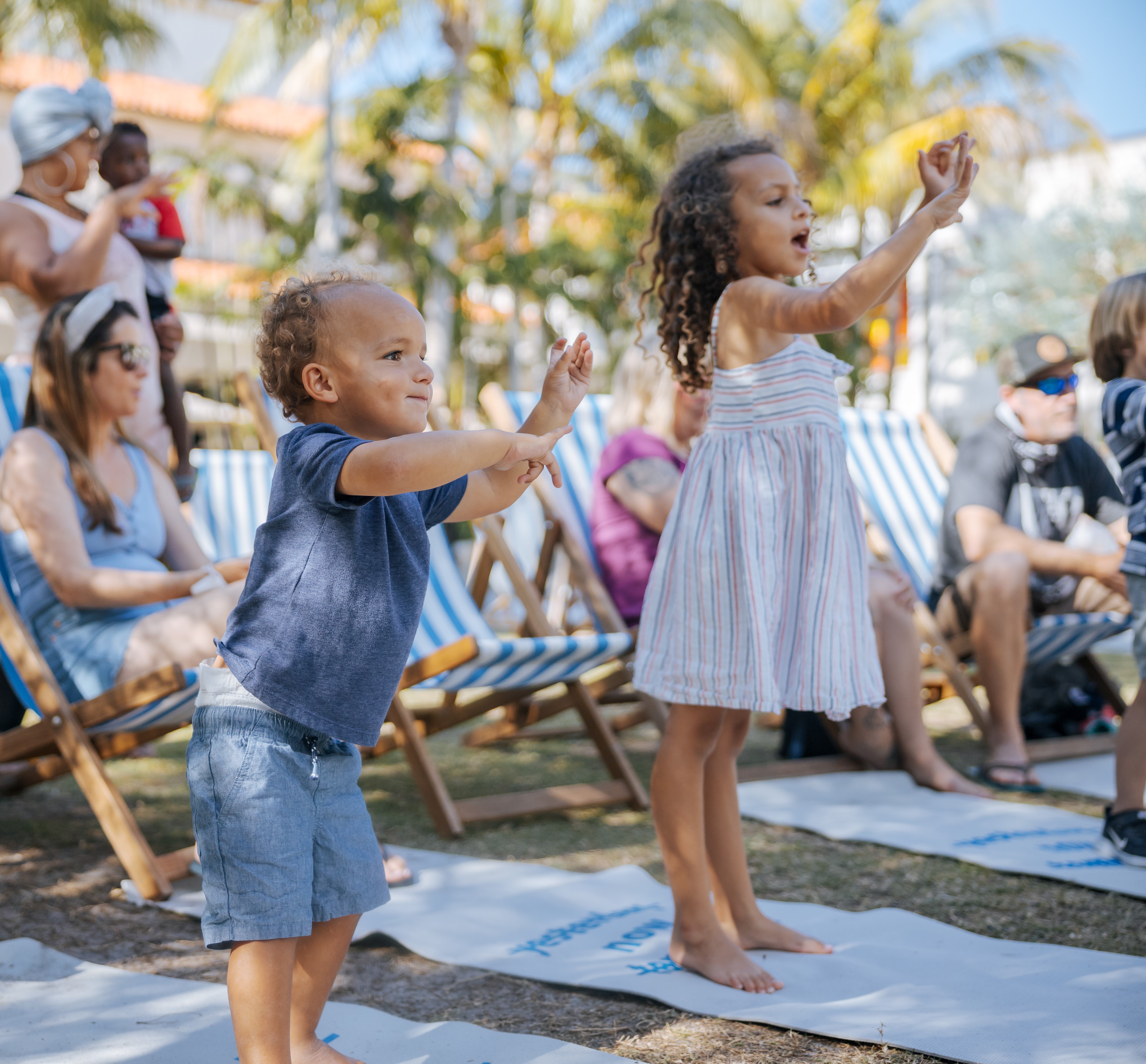 Two young kids dancing 