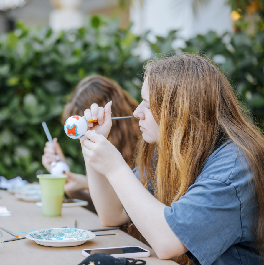 girl painting ornament 