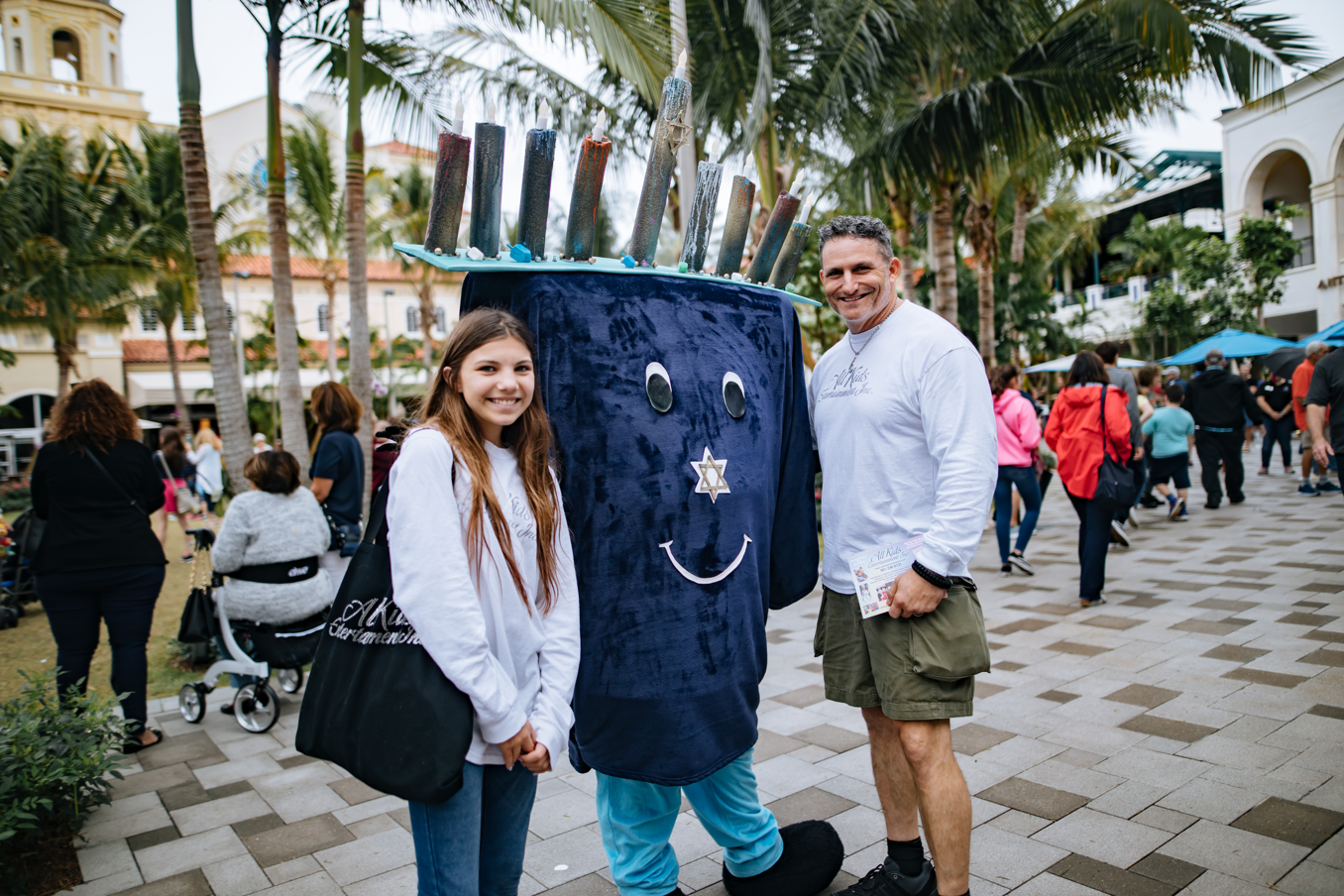 Menorah character poses with family