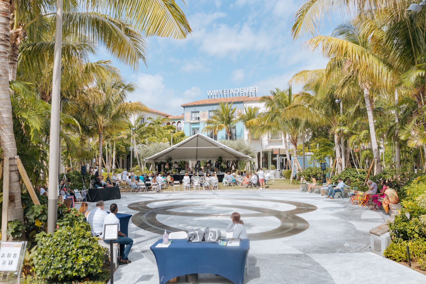 Panel discussion under a tent 