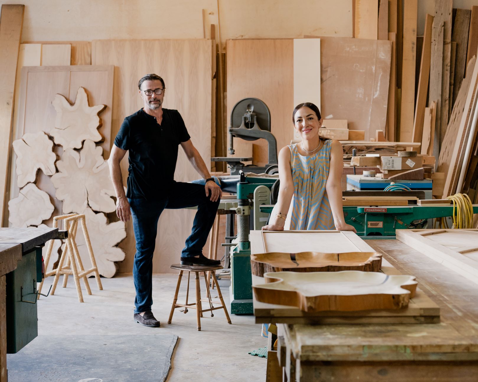 Husband and wife furniture designers in studio 