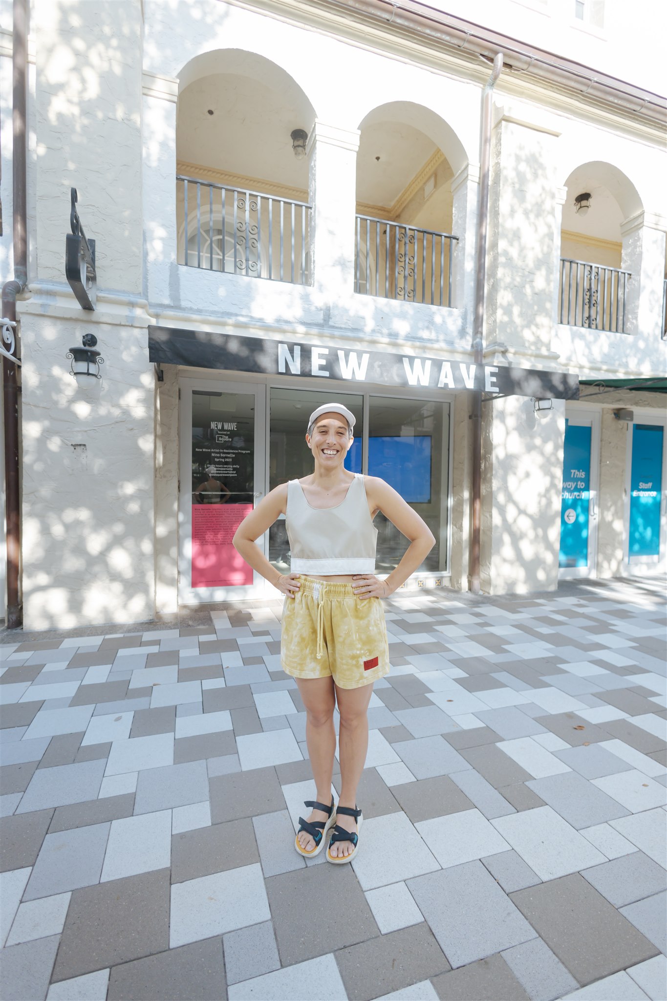Nina Sarnelle in front of New Wave Studio at the Square