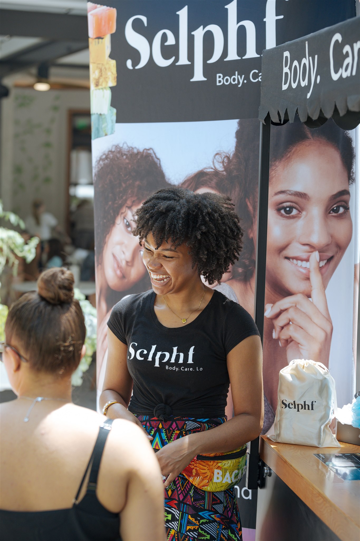 Women selling soap from a cart 
