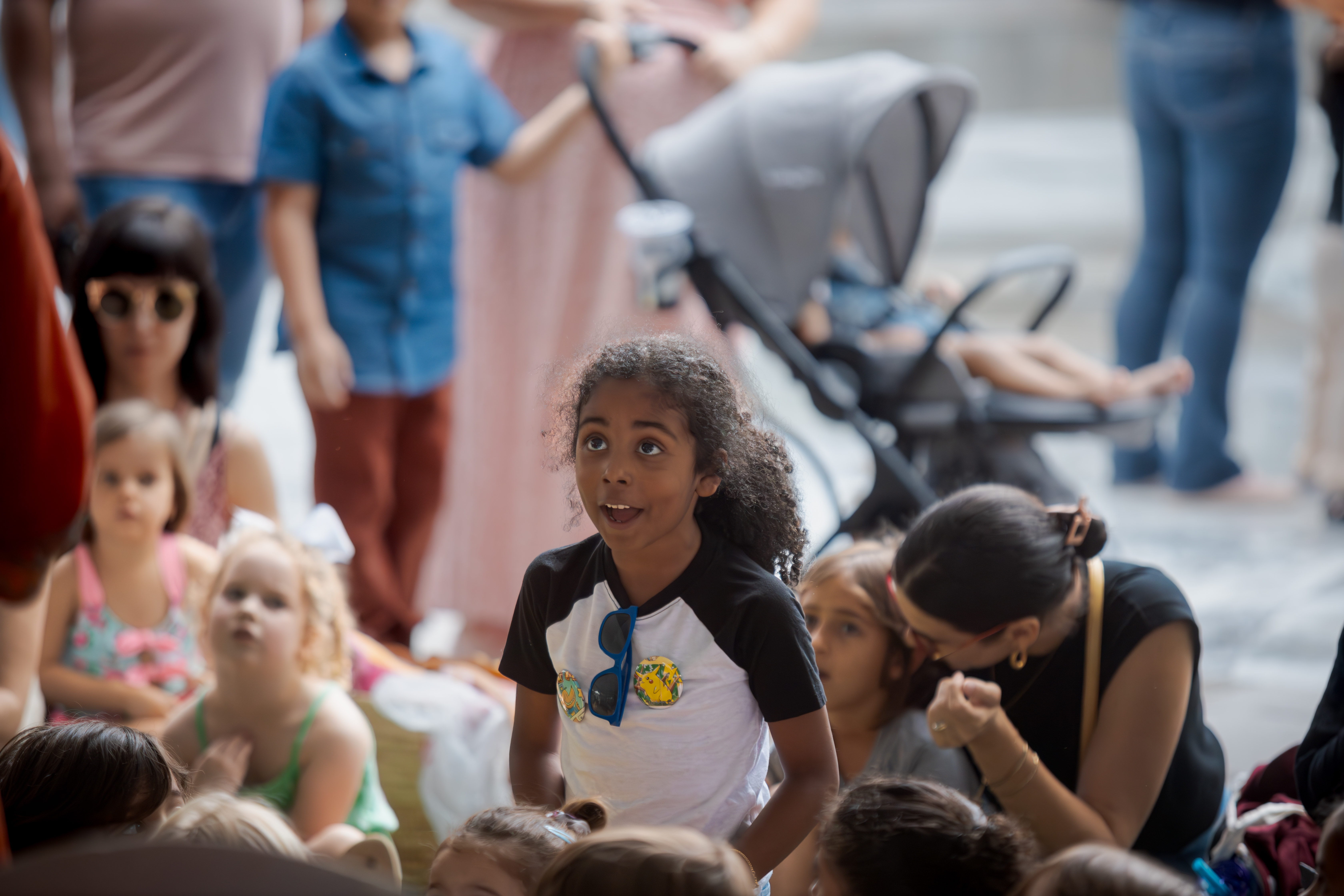 Child on the lawn listening to storytime