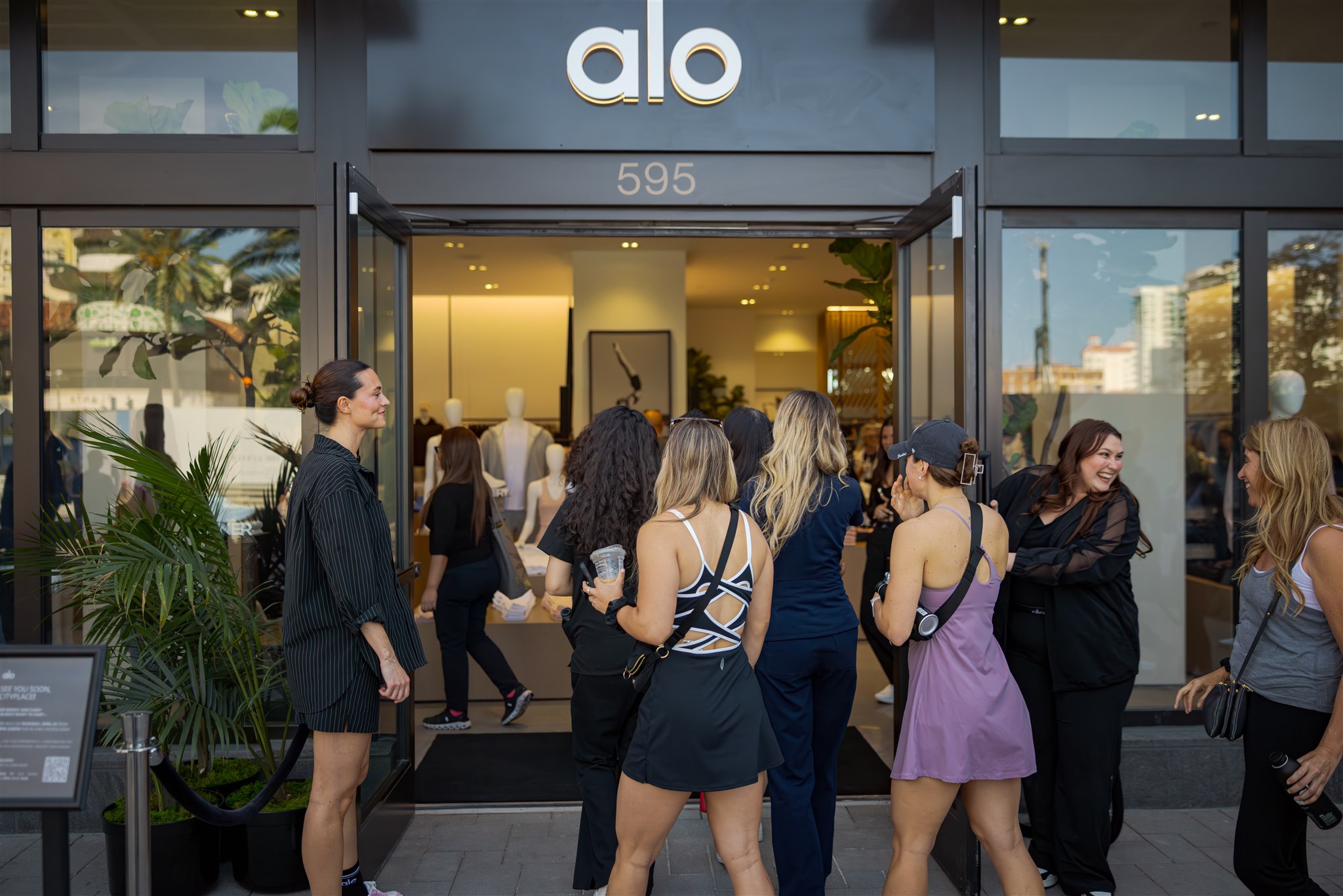 People shopping at Alo