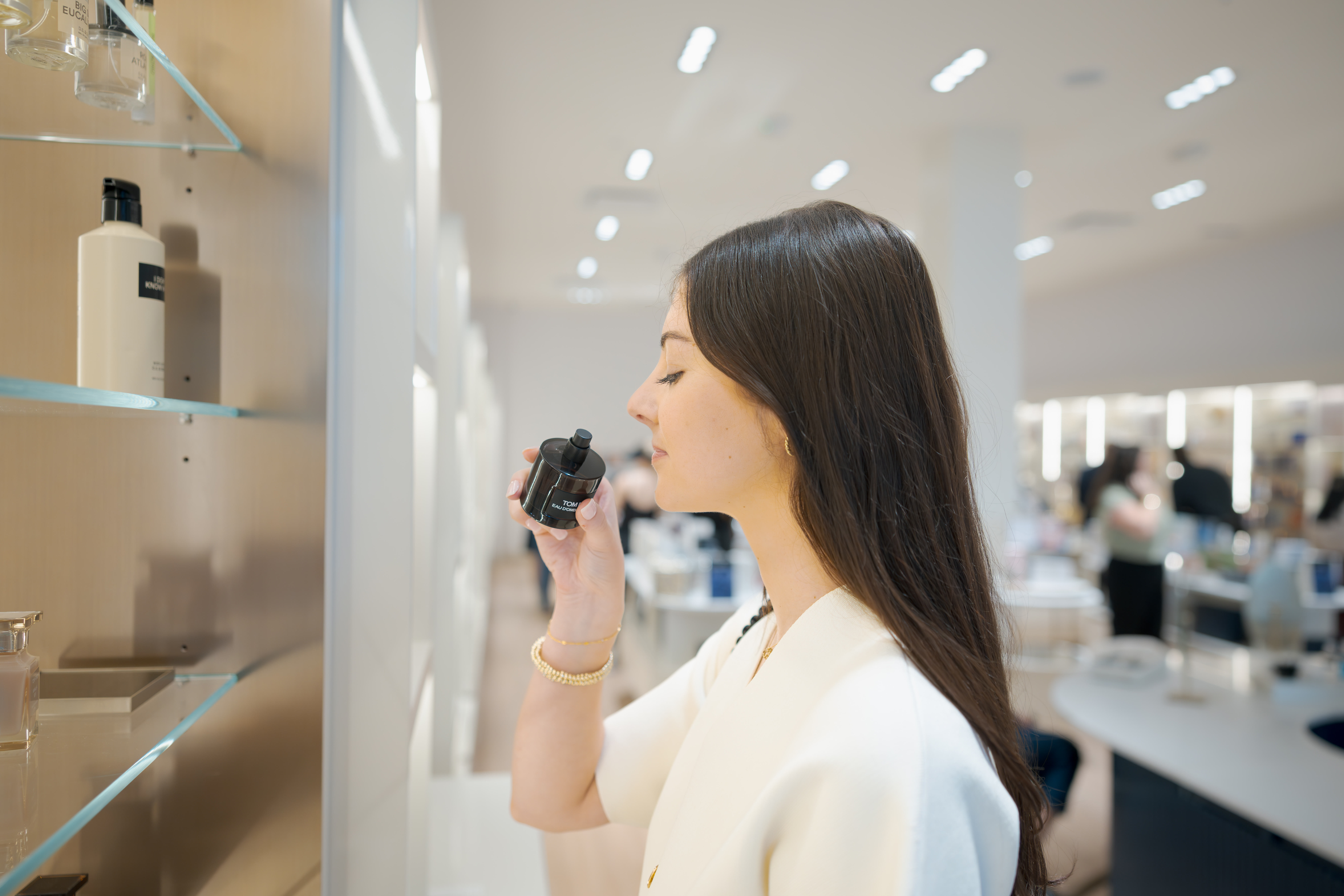 young girl testing perfume
