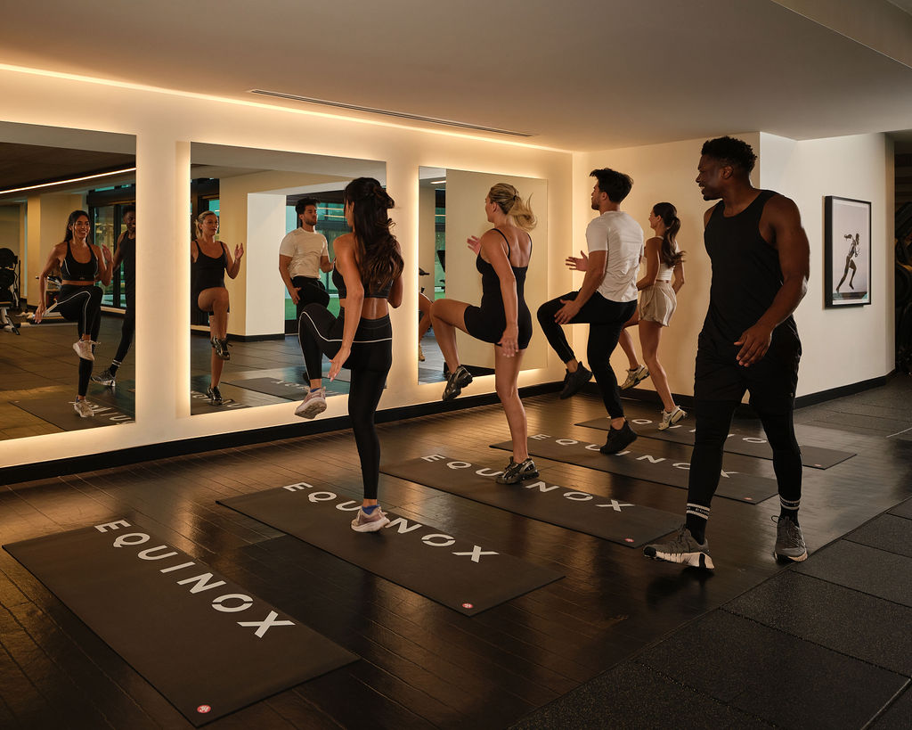 People doing a group workout in an elevated gym