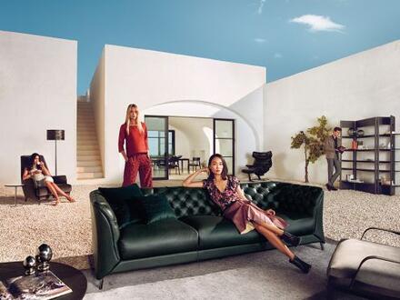 people sit on furniture throughout outdoor patio area