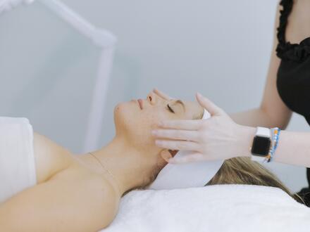 Woman enjoying facial at spa