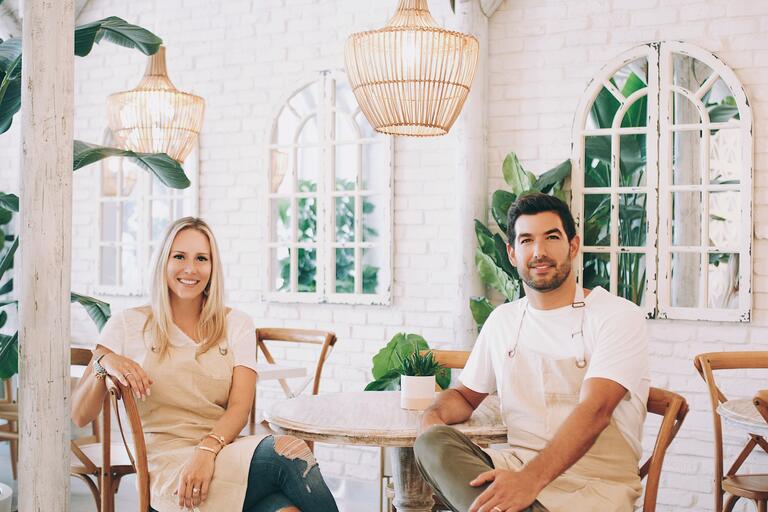 Couple sitting across from eachother in restaurant