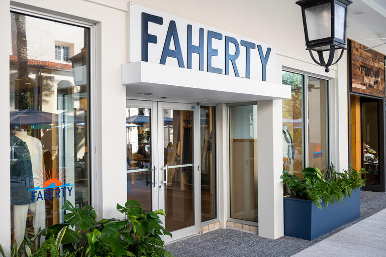 Storefront with blue signage saying Faherty