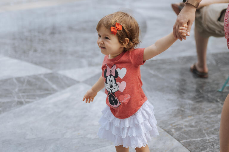 Small child wearing Valentine's Day themed attire at the Water Pavillion