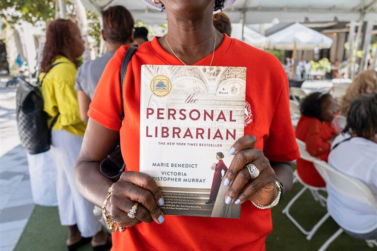 Member of Delta Sigma Theta and a copy of 'Personal Liberation' by Victoria Christopher Murray