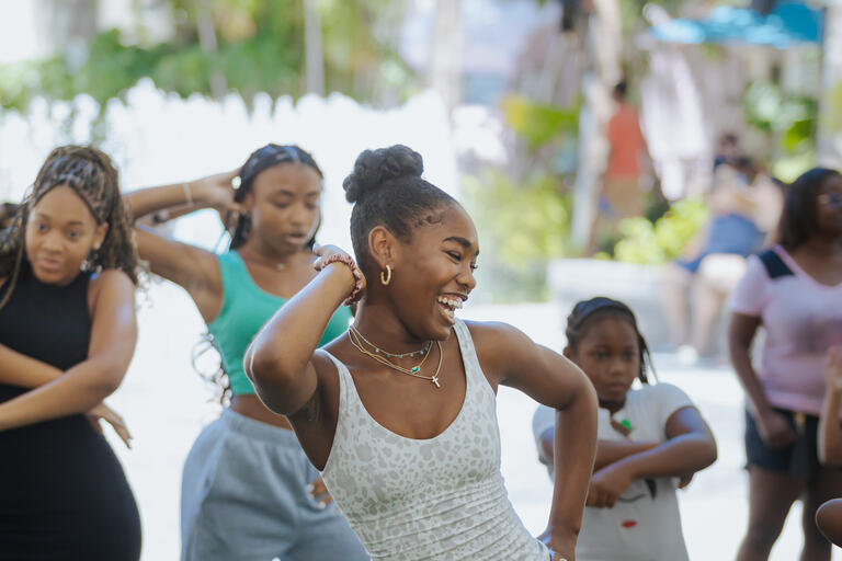 Children dancing on the lawn
