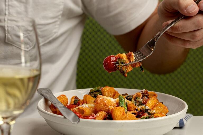 Bowl of pasta with a fork in it