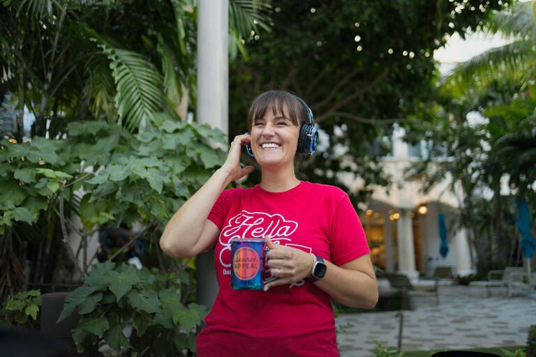 Woman listening to music through headphones