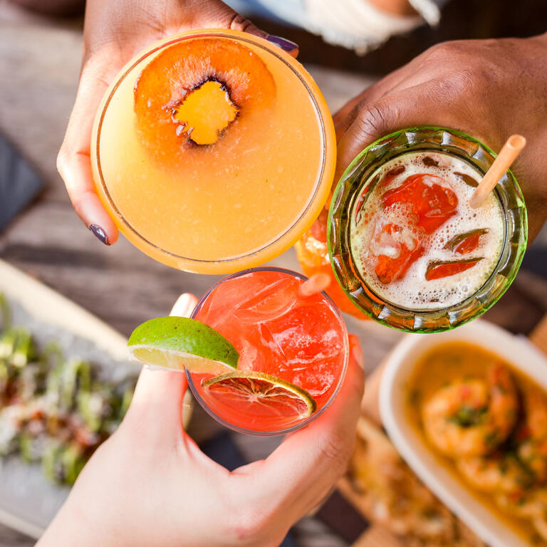 Cheers with three cocktails 