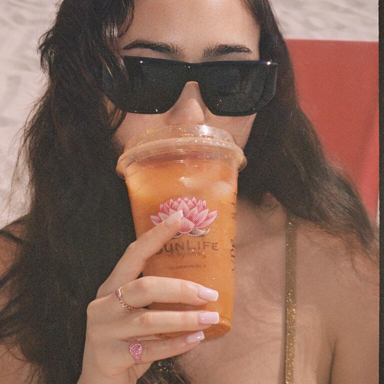 Girl sipping smoothie