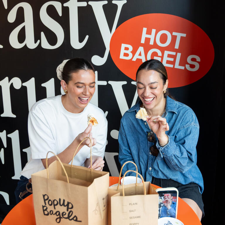 Two Girls Eating Popup Bagels