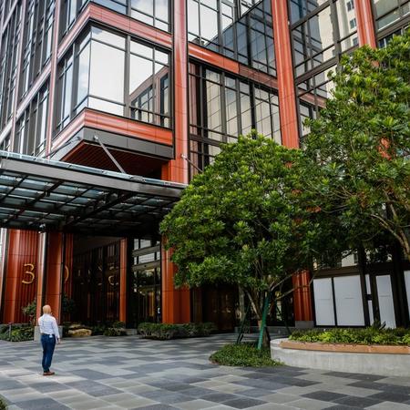 Man standing at foot of office building
