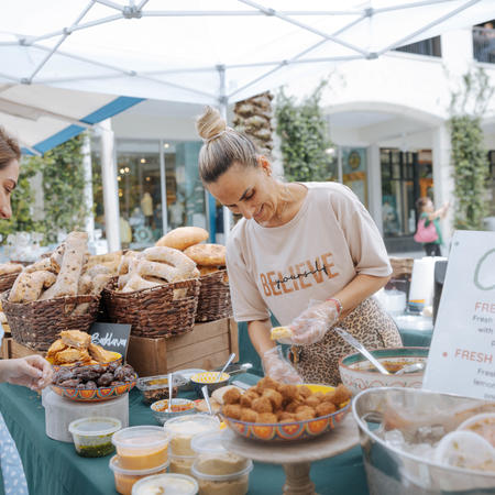 customer shopping at local vendor's market