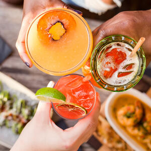 Cheers with three cocktails 